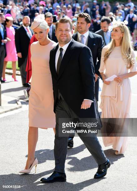 James Corden and wife Julia Carey arrive at St George's Chapel at Windsor Castle before the wedding of Prince Harry to Meghan Markle on May 19, 2018...