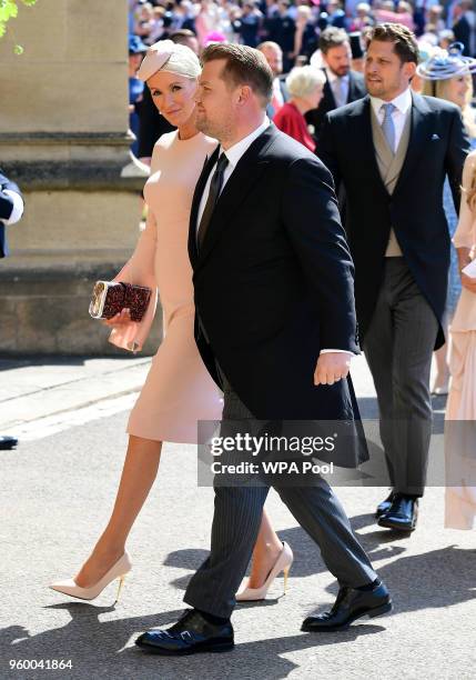 James Corden and wife Julia Carey arrive at St George's Chapel at Windsor Castle before the wedding of Prince Harry to Meghan Markle on May 19, 2018...