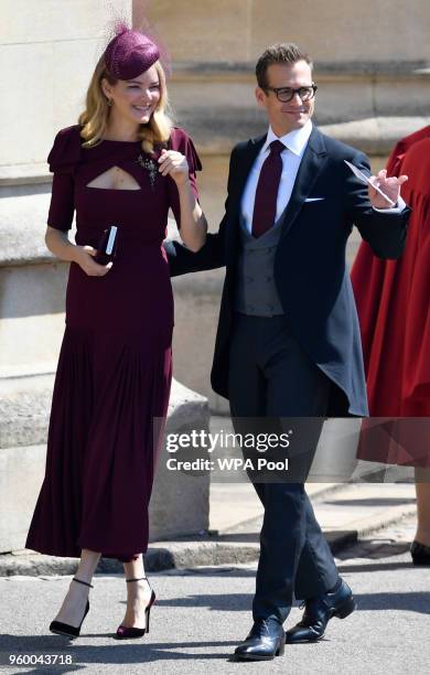 Actor Gabriel Macht and his wife Jacinda Barrett arrive at St George's Chapel at Windsor Castle before the wedding of Prince Harry to Meghan Markle...