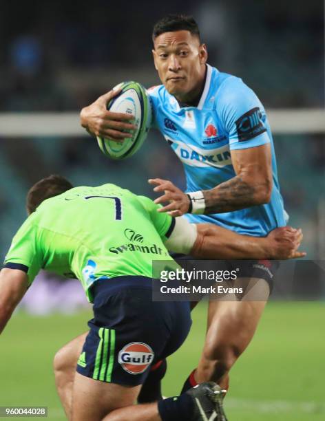 Israel Folau of the Waratahs is tackled by Dillon Hunt of the Highlanders during the round 14 Super Rugby match between the Waratahs and the...