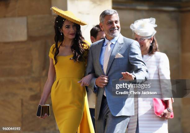 Amal Clooney and George Clooney arrive at the wedding of Prince Harry to Ms Meghan Markle at St George's Chapel, Windsor Castle on May 19, 2018 in...