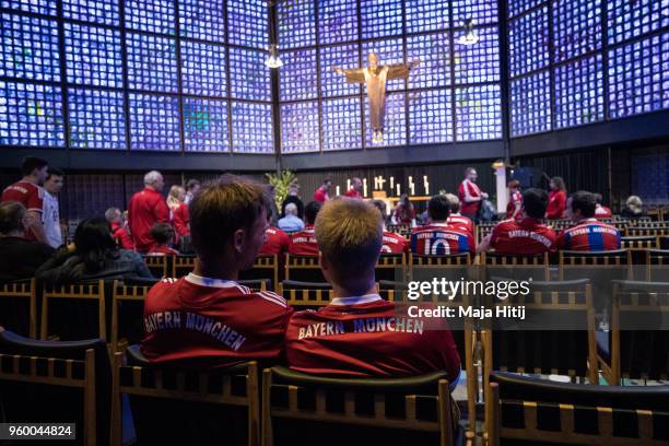 Fans of Bayern Muenchen attend Ecumencial Church Service prior DFB Cup Final 2018 on May 19, 2018 in the Kaiser Wilhelm Memorial Church in Berlin,...