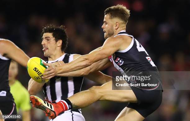 Scott Pendlebury of the Magpies and Maverick Weller of the Saints compete for the ball during the round nine AFL match between the St Kilda Saints...