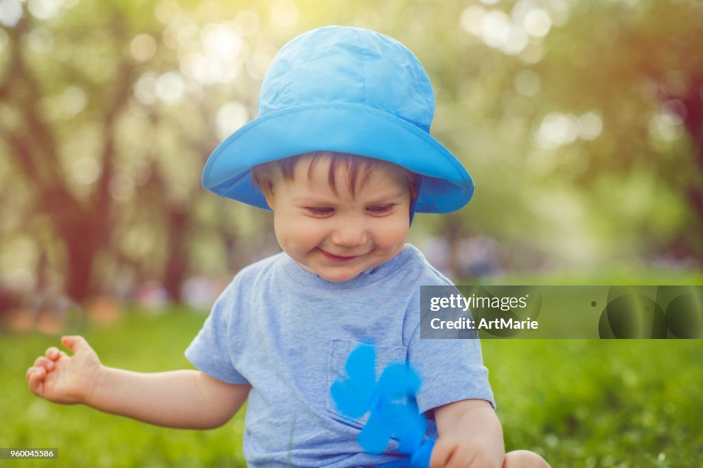 Cute toddler enjoying warm summer day