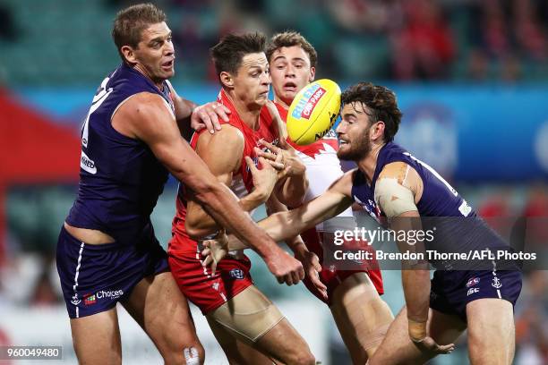 Callum Sinclair of the Swans contests the ball with Aaron Sandilands of the Dockers during the round nine AFL match between the Sydney Swans and the...