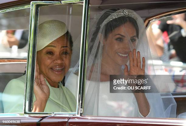 Meghan Markle and her mother, Doria Ragland, arrive for her wedding ceremony to marry Britain's Prince Harry, Duke of Sussex, at St George's Chapel,...