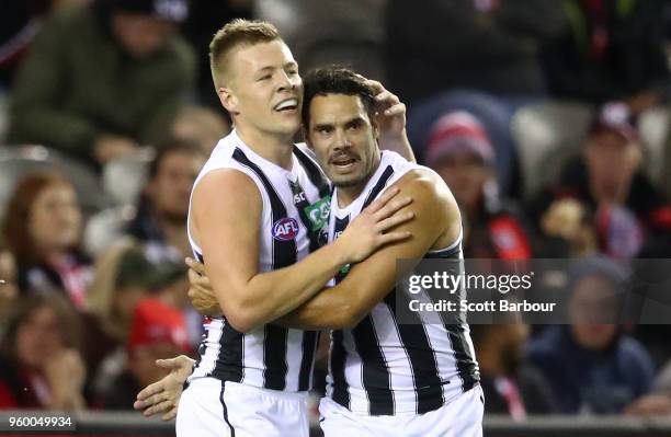 Jordan De Goey of the Magpies and Daniel Wells of the Magpies celebrate after kicking a goal during the round nine AFL match between the St Kilda...