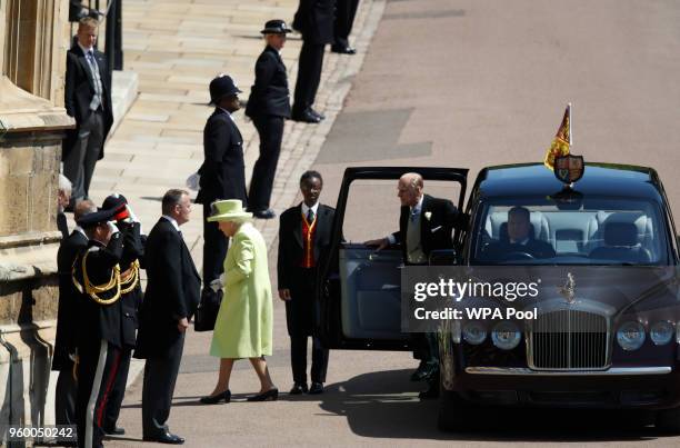 Britain's Queen Elizabeth II and Britain's Prince Philip, Duke of Edinburgh arrive for the wedding ceremony of Prince Harry and US actress Meghan...