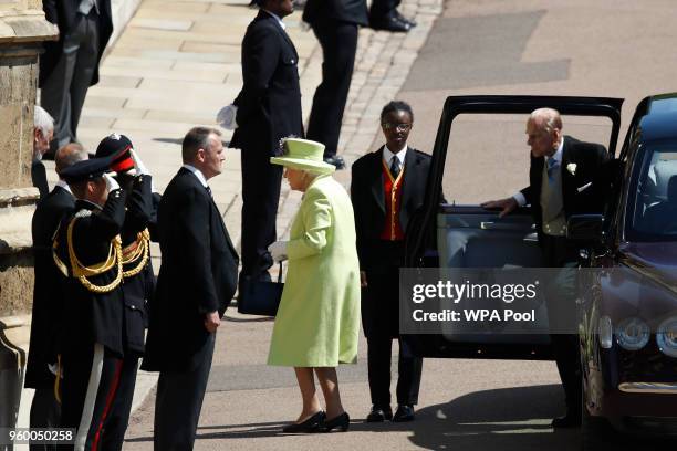 Britain's Queen Elizabeth II and Britain's Prince Philip, Duke of Edinburgh arrive for the wedding ceremony of Prince Harry and US actress Meghan...