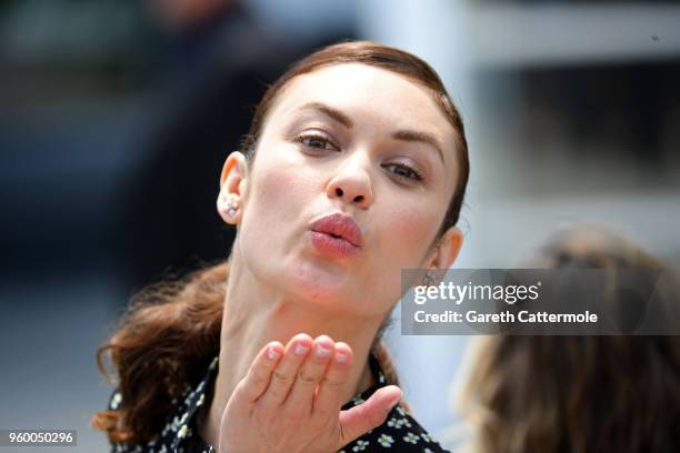 Olga Kurylenko blows a kiss during "The Man Who Killed Don Quixote" Photocall during the 71st annual Cannes Film Festival at Palais des Festivals on...