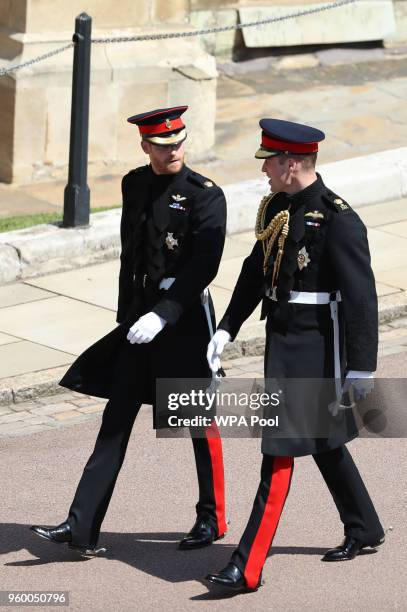 Prince Harry and Prince William, Duke of Cambridge arrive at St George's Chapel at Windsor Castle before the wedding of Prince Harry to Meghan Markle...