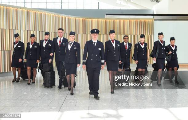 British Airways cabin crew, all named Harry or Meghan, who will be operating today's Heathrow to Toronto flight in celebration of the Royal Wedding...