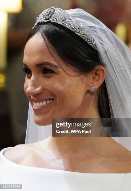 Meghan Markle smiles during her wedding to Prince Harry in St George's Chapel at Windsor Castle on May 19, 2018 in Windsor, England.