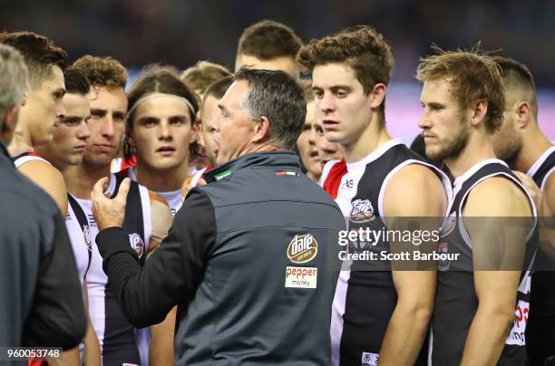 Alan Richardson, coach of the Saints speaks to his team during a quarter time break during the round nine AFL match between the St Kilda Saints and...