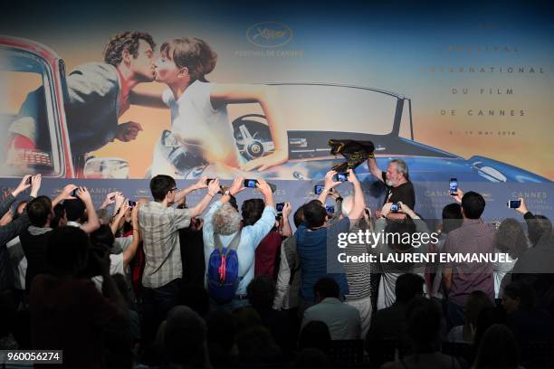 British-US director Terry Gilliam arrives to attend on May 19, 2018 a press conference for the film "The Man Who Killed Don Quixote" at the 71st...