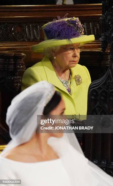 Britain's Queen Elizabeth II looks on during the wedding ceremony of Britain's Prince Harry, Duke of Sussex and US actress Meghan Markle in St...