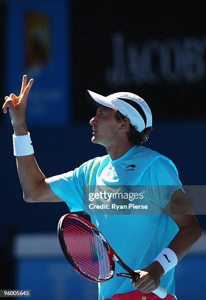 Denis Istomin of Uzbekistan celebrates winning a point in his third round match against Novak Djokovic of Serbia during day six of the 2010...