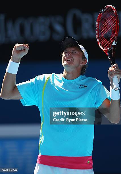 Denis Istomin of Uzbekistan celebrates winning a point in his third round match against Novak Djokovic of Serbia during day six of the 2010...