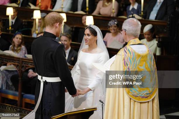 Prince Harry and Meghan Markle during their wedding service, conducted by the Archbishop of Canterbury Justin Welby in St George's Chapel at Windsor...
