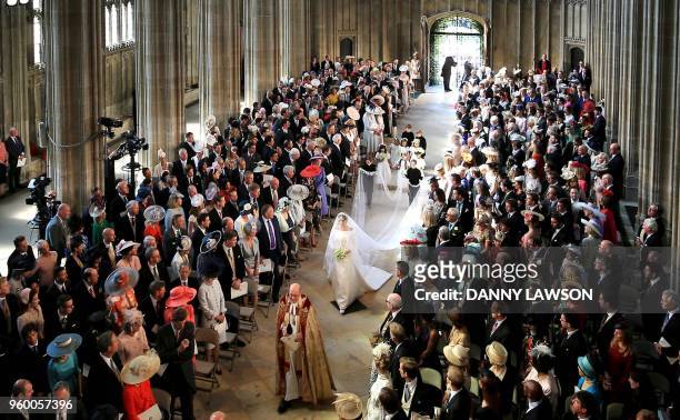 Actress Meghan Markle walks down the aisle in St George's Chapel, Windsor Castle, in Windsor, on May 19, 2018 during her wedding to Britain's Prince...