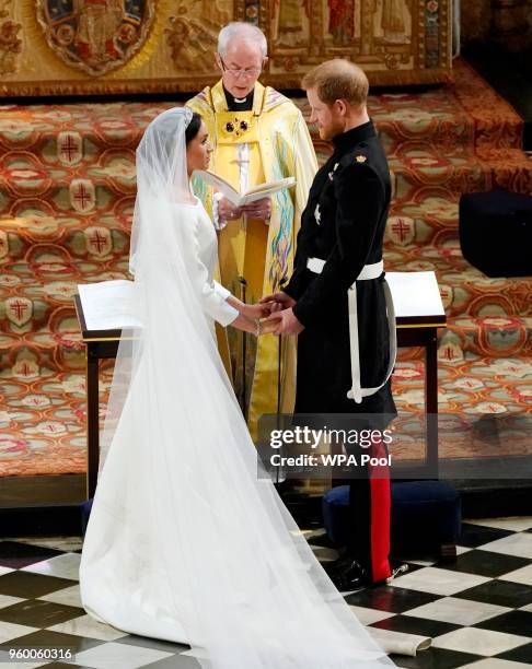 Prince Harry and Meghan Markle exchange vows during their wedding ceremony in St George's Chapel at Windsor Castle on May 19, 2018 in Windsor,...