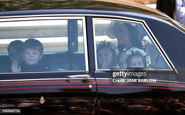 Britain's Catherine, Duchess of Cambridge and Prince Harry's niece and bridesmaid Princess Charlotte arrive for the wedding ceremony of Britain's...