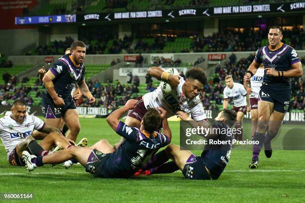 Moses Suli of the Manly Sea Eagles crosses the line to score a try during the round 11 NRL match between the Melbourne Storm and the Manly Sea Eagles...