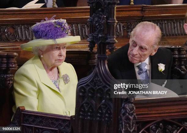 Britain's Queen Elizabeth II and Britain's Prince Philip, Duke of Edinburgh during the wedding ceremony of Britain's Prince Harry, Duke of Sussex and...