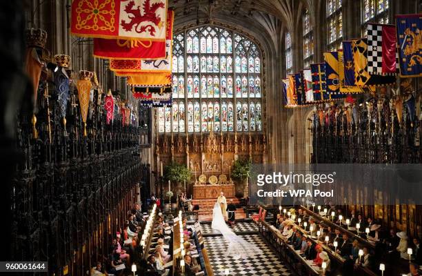 Prince Harry and Meghan Markle exchange vows during their wedding ceremony in St George's Chapel at Windsor Castle on May 19, 2018 in Windsor,...
