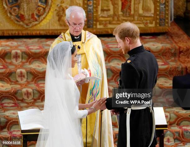 Prince Harry and Meghan Markle exchange vows during their wedding ceremony in St George's Chapel at Windsor Castle on May 19, 2018 in Windsor,...