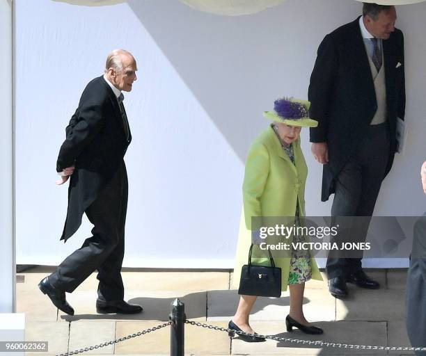 Britain's Queen Elizabeth II and Britain's Prince Philip, Duke of Edinburgh arrive for the wedding ceremony of Britain's Prince Harry, Duke of Sussex...