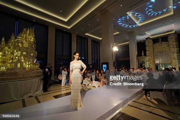 Model wears a dress from a bridal collection created by Sebastian Gunawan, an Indonesian high-fashion designer, during a wedding exhibition at the...