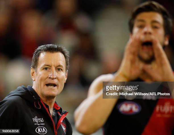 John Worsfold, Senior Coach of the Bombers is seen during the 2018 AFL round nine match between the Essendon Bombers and the Geelong Cats at the...
