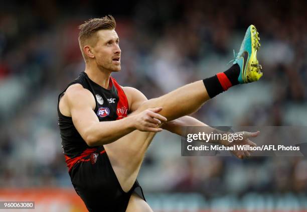 Shaun McKernan of the Bombers kicks a goal during the 2018 AFL round nine match between the Essendon Bombers and the Geelong Cats at the Melbourne...