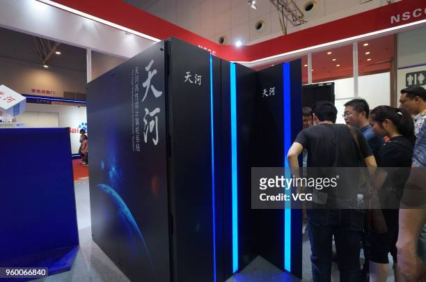 Visitors watch the prototype of Chinese supercomputer Tianhe-3 at World Intelligence Expo as part of the 2nd World Intelligence Congress on May 19,...