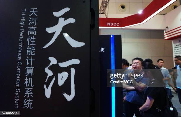 Visitors watch the prototype of Chinese supercomputer Tianhe-3 at World Intelligence Expo as part of the 2nd World Intelligence Congress on May 19,...