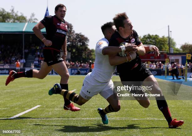 Chris Wyles of Saracens on his way to score his sides third try during the Aviva Premiership Semi-Final match between Saracens and Wasps at Allianz...