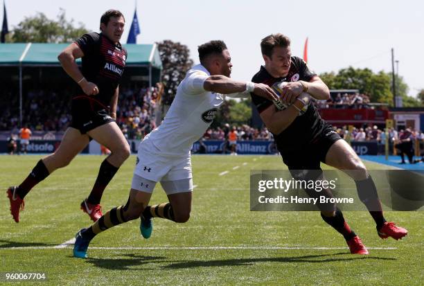 Chris Wyles of Saracens on his way to score his sides third try during the Aviva Premiership Semi-Final match between Saracens and Wasps at Allianz...