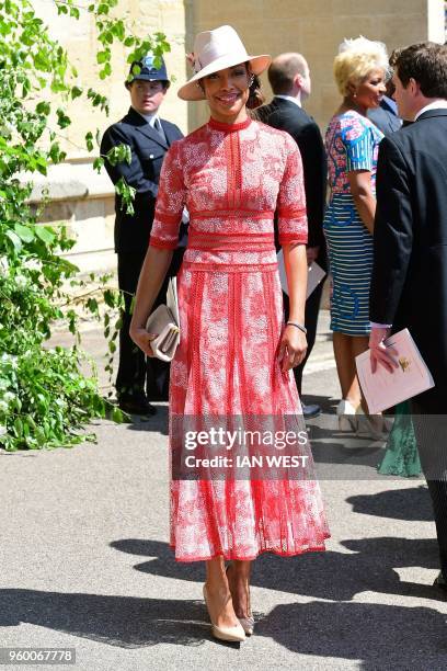 Meghan Markle's friend, US actress Gina Torres leaves after attending the wedding ceremony of Britain's Prince Harry, Duke of Sussex and US actress...