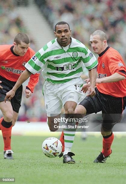 Didier Agathe of Celtic evades the Dundee united defence during the Tennants Scottish Cup Semi-final between Celtic and Dundee United played at...