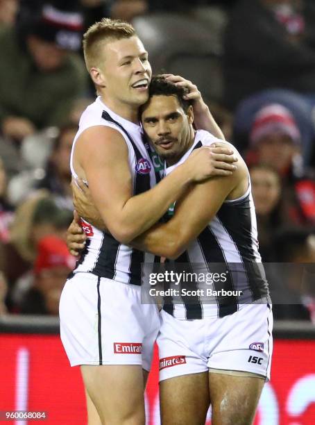 Jordan De Goey of the Magpies and Daniel Wells of the Magpies celebrate after kicking a goal during the round nine AFL match between the St Kilda...