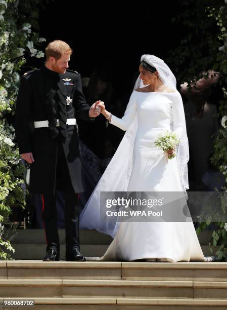 Prince Harry and Meghan Markle leave St George's Chapel after their wedding in St George's Chapel at Windsor Castle on May 19, 2018 in Windsor,...