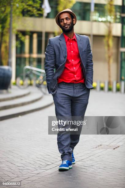 careless man in suit with hands in pockets - clumsy walker stock pictures, royalty-free photos & images