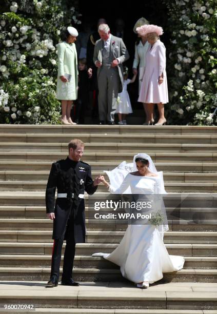 Prince Harry and Meghan Markle leave St George's Chapel after their wedding followed by Doria Ragland, mother of the bride, Prince Charles, Prince of...