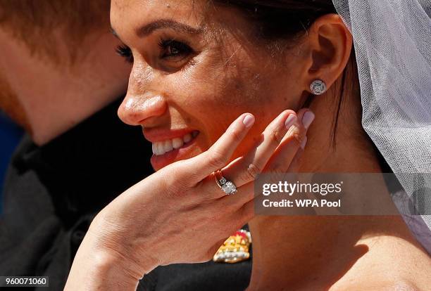 Prince Harry, Duke of Sussex and The Duchess of Sussex leave Windsor Castle in the Ascot Landau carriage during a procession after getting married at...