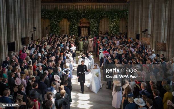 Prince Harry and Meghan Markle leave St George's Chapel at Windsor Castle after their wedding on May 19, 2018 in Windsor, England.