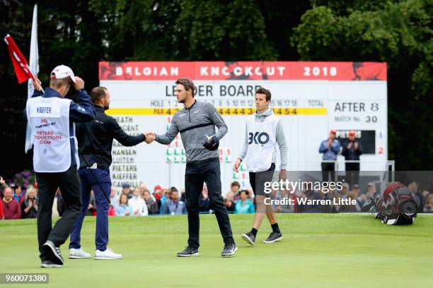 Thomas Pieters of Belgium shakes hands with Maximilian Kieffer of Germany after their match on the 18th green during the knockout stage on day three...