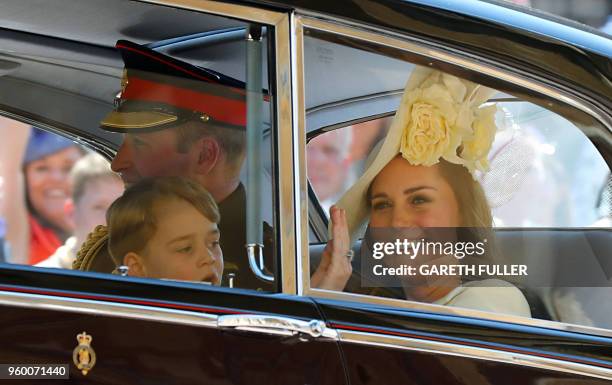 Britain's Catherine, Duchess of Cambridge , Britain's Prince William, Duke of Cambridge and Prince Harry's nephew and page boy Prince George leave...