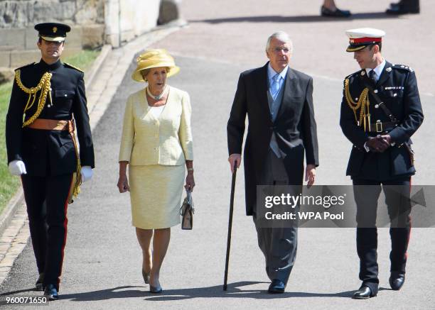 Former British Prime Minister Sir John Major and his wife Dame Norma Major arrive at St George's Chapel at Windsor Castle before the wedding of...