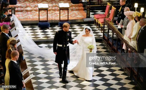 Prince Harry, Duke of Sussex and The Duchess of Sussex depart following their wedding in St George's Chapel at Windsor Castle on May 19, 2018 in...